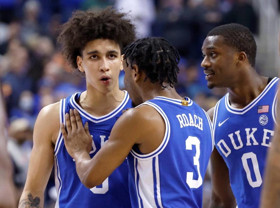 Duke’s Jeremy Roach (3) and Dariq Whitehead (0) talk with Tyrese Proctor (5) during the second half of Duke’s 85-78 victory over Miami in the semifinals of the ACC Men’s Basketball Tournament in Greensboro, N.C., Friday, March 10, 2023.