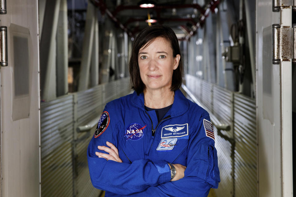 In this Tuesday, June 25, 2019 photo made available by NASA, astronaut Megan McArthur poses for a portrait at the Kennedy Space Center in Florida. McArthur is a member of the crew for SpaceX's third astronaut launch to the International Space Station on Friday, April 23, 2021. (Joel Kowsky/NASA via AP)