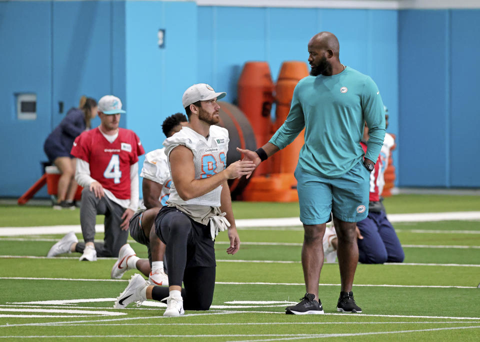 Miami Dolphins tight end Durham Smythe (81) talks with quality control coach Kolby Smith during practice at Baptist Health Training Complex in Hard Rock Stadium on Wednesday, October 20, 2021 in Miami Gardens, Florida, in preparation for their game against the Atlanta Falcons at Hard Rock Stadium on Sunday, October 24.(David Santiago/Miami Herald via AP)