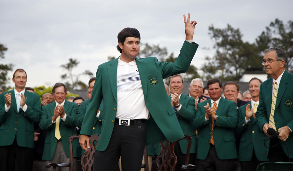 Bubba Watson waves after being presented with his green jacket after winning the Masters golf tournament Sunday, April 13, 2014, in Augusta, Ga. (AP Photo/Matt Slocum)