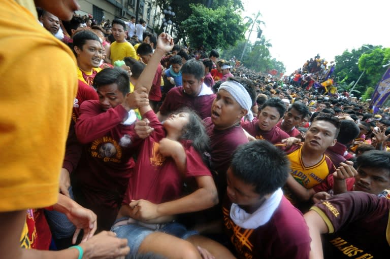 Hundreds were injured during the religious gathering as shoeless devotees hurled themselves at a statue of Jesus believed to have healing powers