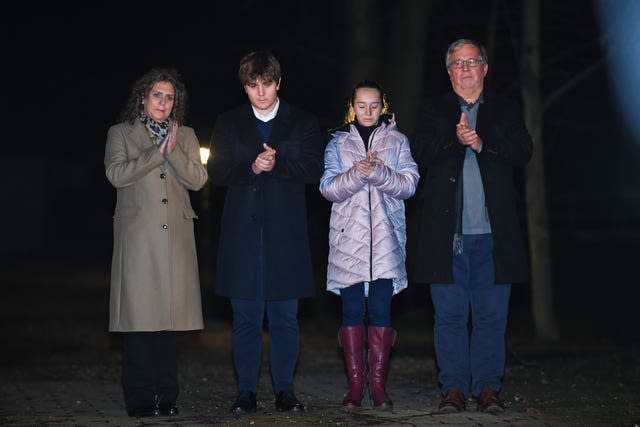 Captain Sir Tom Moore’s daughter Hannah Ingram-Moore, grandson Benji, granddaughter Georgia and son-in-law Colin Ingram outside his the home in Marston Moretaine, Bedfordshire 