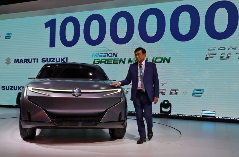 Kenichi Ayukawa, Chief Executive Officer of Maruti Suzuki India Ltd., poses with concept Futuro-e car after it was unveiled at the India Auto Expo 2020 in Greater Noida