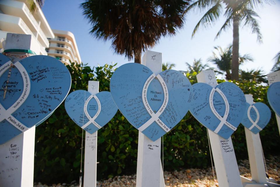 Posts memorializing the victims of the June 24 2021 Surfside condo collapse are seen at the former location of Champlain Towers South condo in Surfside, FL., on Friday, June 24, 2022.