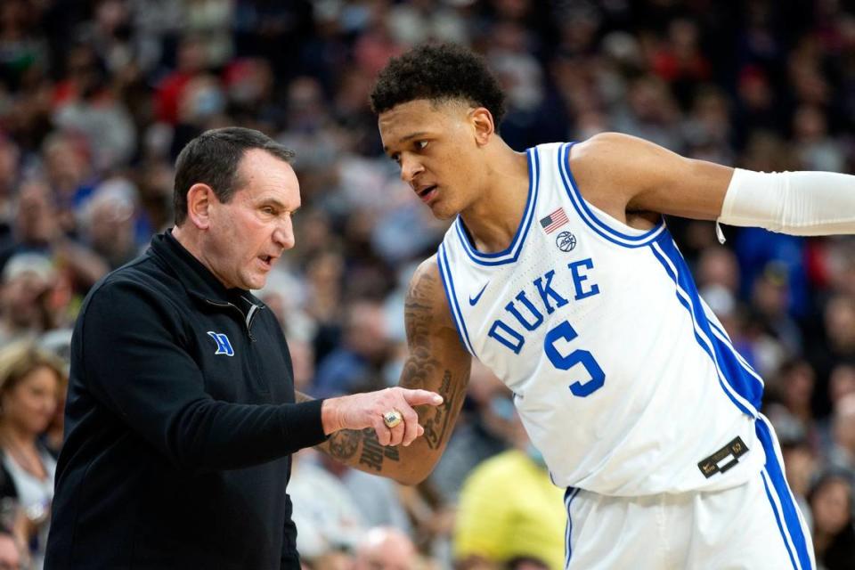 Duke coach Mike Krzyzewski talks to forward Paolo Banchero during the second half of the team’s NCAA college basketball game against Gonzaga on Friday, Nov. 26, 2021, in Las Vegas. (AP Photo/Ellen Schmidt)