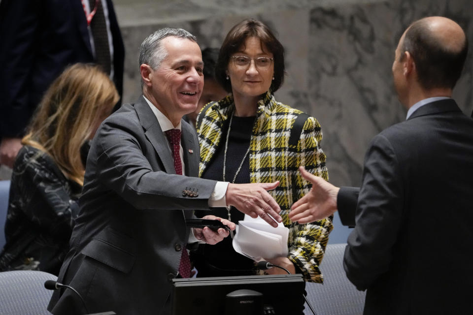 Ignazio Cassis, Federal Councillor for Foreign Affairs of Switzerland and current president of the United Nations Security Council, left, closes a meeting of the council alongside Pascale Baeriswyl, Permanent Ambassador of Switzerland to the United Nations, center, Wednesday, May 3, 2023, at United Nations headquarters. (AP Photo/John Minchillo)