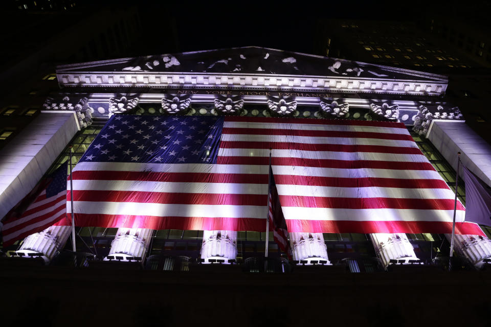 An American flag hangs on the front of the New York Stock Exchange. (AP Photo/Peter Morgan, File)