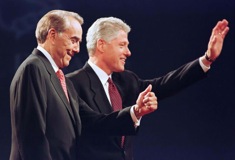 FILE PHOTO: Republican presidential nominee Bob Dole (L) gives a thumb up in Hartford