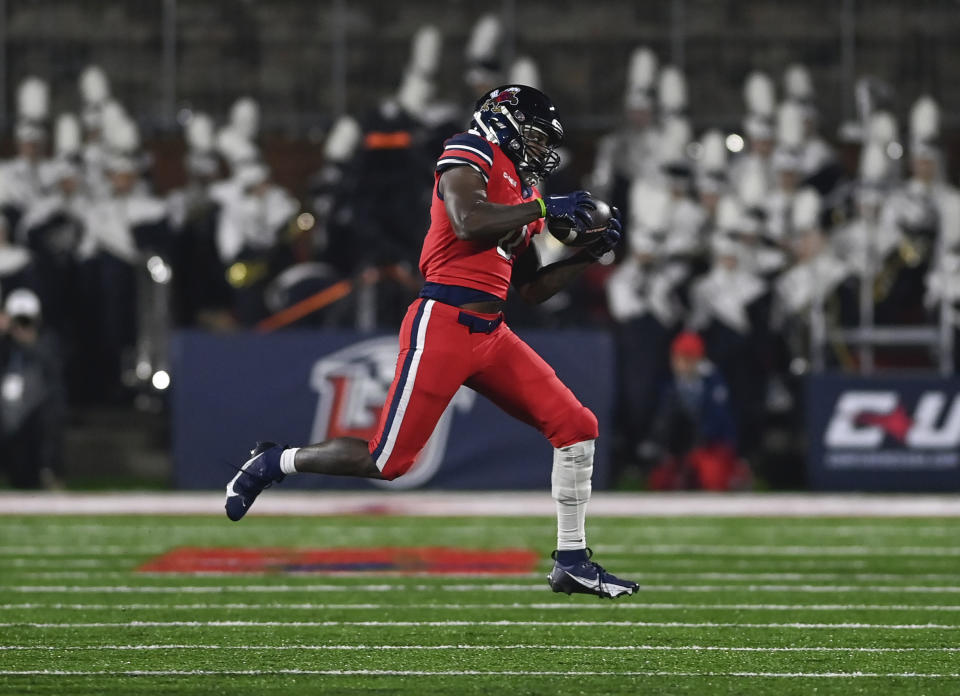 Liberty's Billy Lucas catches a pass against New Mexico State during the Conference USA championship NCAA college football game Friday, Dec. 1, 2023, in Lynchburg, Va. (Paige Dingler/The News & Advance via AP)