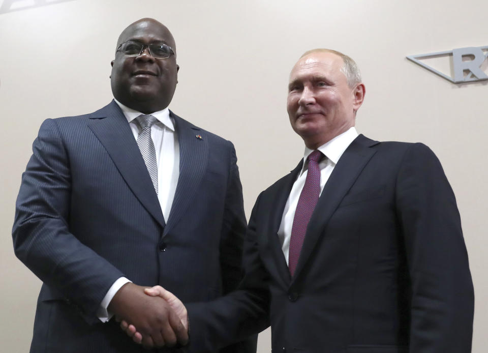 Russian President Vladimir Putin, right, and Republic of Congo's President Felix Tshisekedi pose for a photo during their meeting on the sideline of Russia-Africa summit in the Black Sea resort of Sochi, Russia, Wednesday, Oct. 23, 2019. (Donat Sorokin, TASS News Agency Pool Photo via AP)