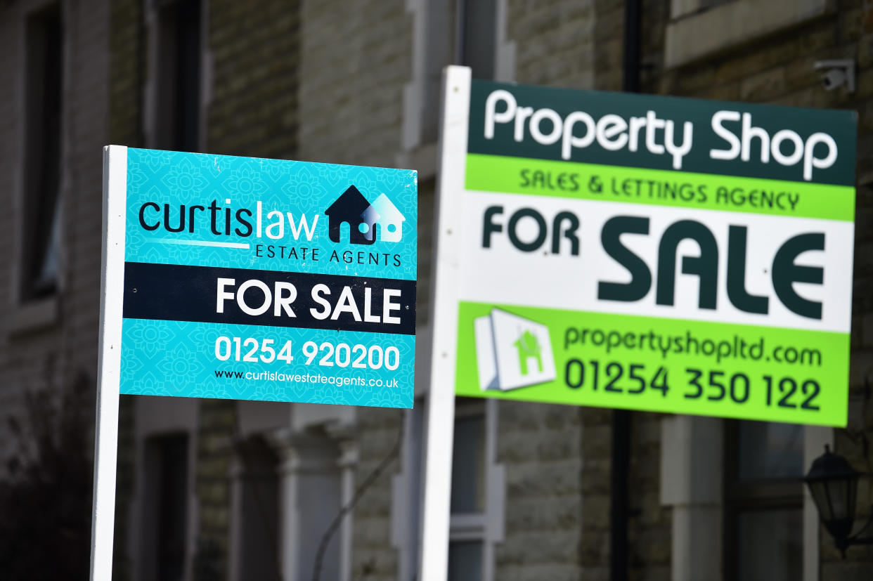 BLACKBURN, ENGLAND - APRIL 29: Placards from various housing estates agents advertising properties for sale on April 29, 2021 in Blackburn, England. (Photo by Nathan Stirk/Getty Images)