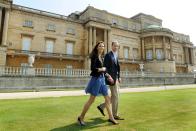 <p><em>April 30, 2011 —</em> As she left for her honeymoon, Kate paired a blue sundress with her go-to accessories: a blazer and wedge heels.</p>