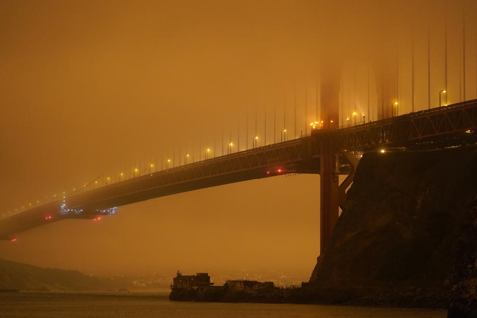 FILE - The Golden Gate Bridge is barely visible through smoke from wildfires Wednesday morning, Sept. 9, 2020, in this view from Fort Baker near Sausalito, Calif. The Census Bureau is contending with several natural disasters as wildfires and hurricanes disrupt the final weeks of the nation’s once-a-decade headcount. (AP Photo/Eric Risberg, File)