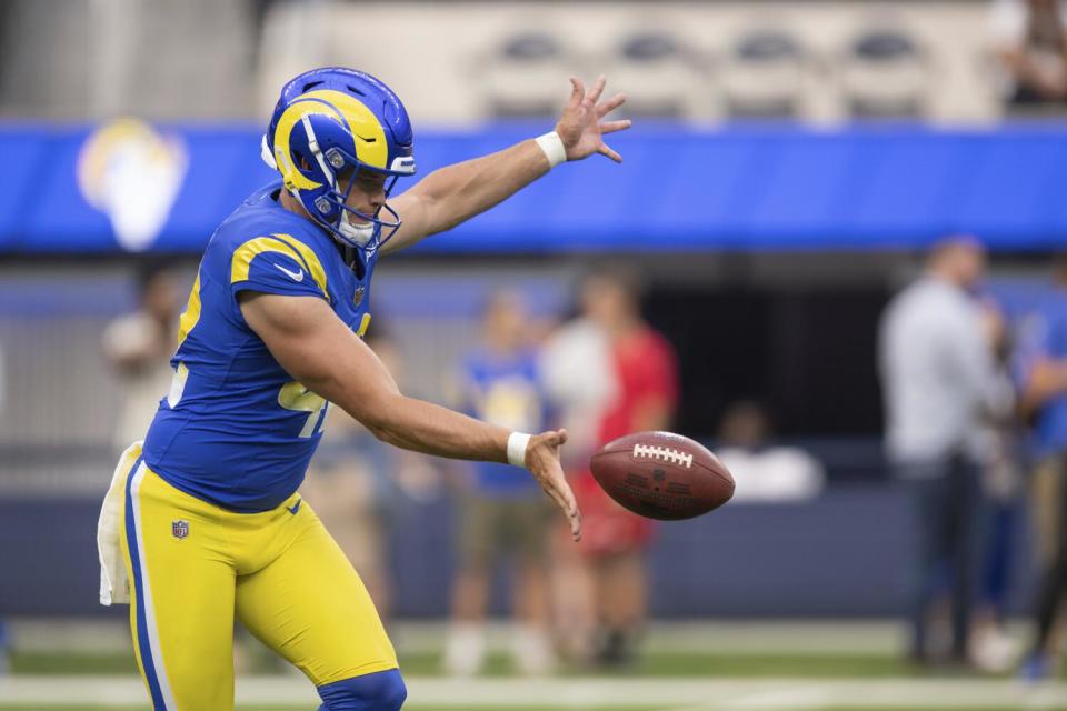 The Rams' Ethan Evans (42) punts before an NFL preseason football game against the Las Vegas Raiders.