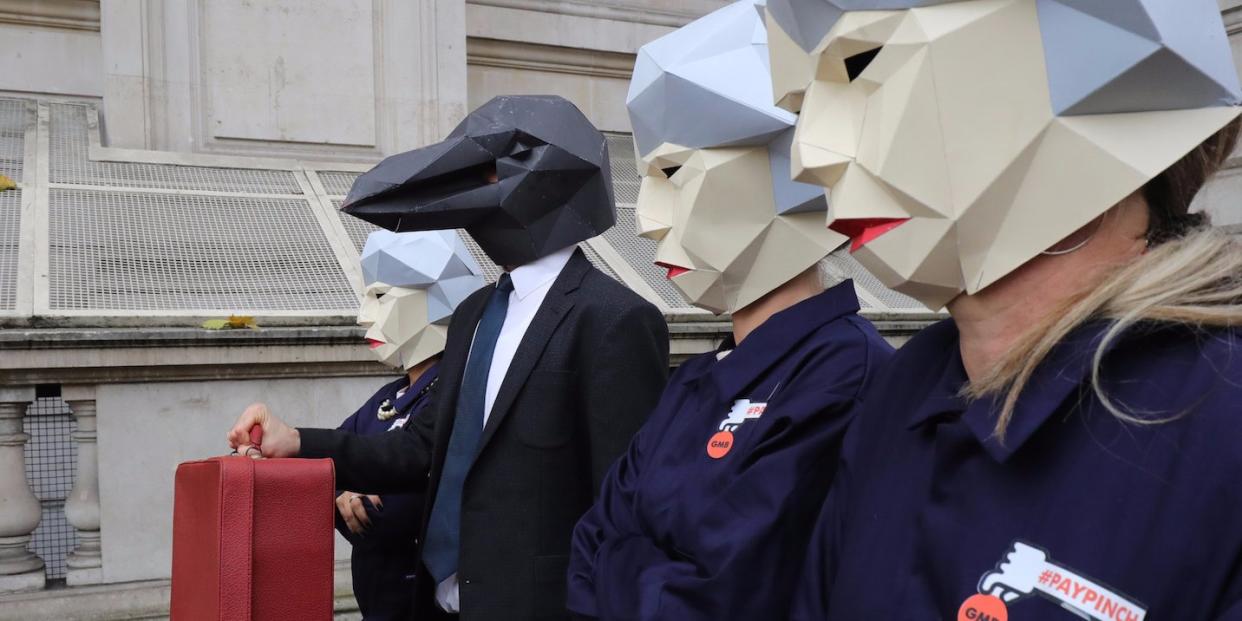 Protestors dressed as 'Maybots' demonstrate at the entrance of Downing Street as cabinet leave following a meeting ahead of the Chancellor's annual budget on November 22, 2017 in London, England. Later today Chancellor of the Exchequer Philip Hammond will deliver his 2017 budget to Parliament. The conservative government is continuing with its aim of reducing the deficit and balancing the books as the UK negotiates its departure from the European Union (Photo by )