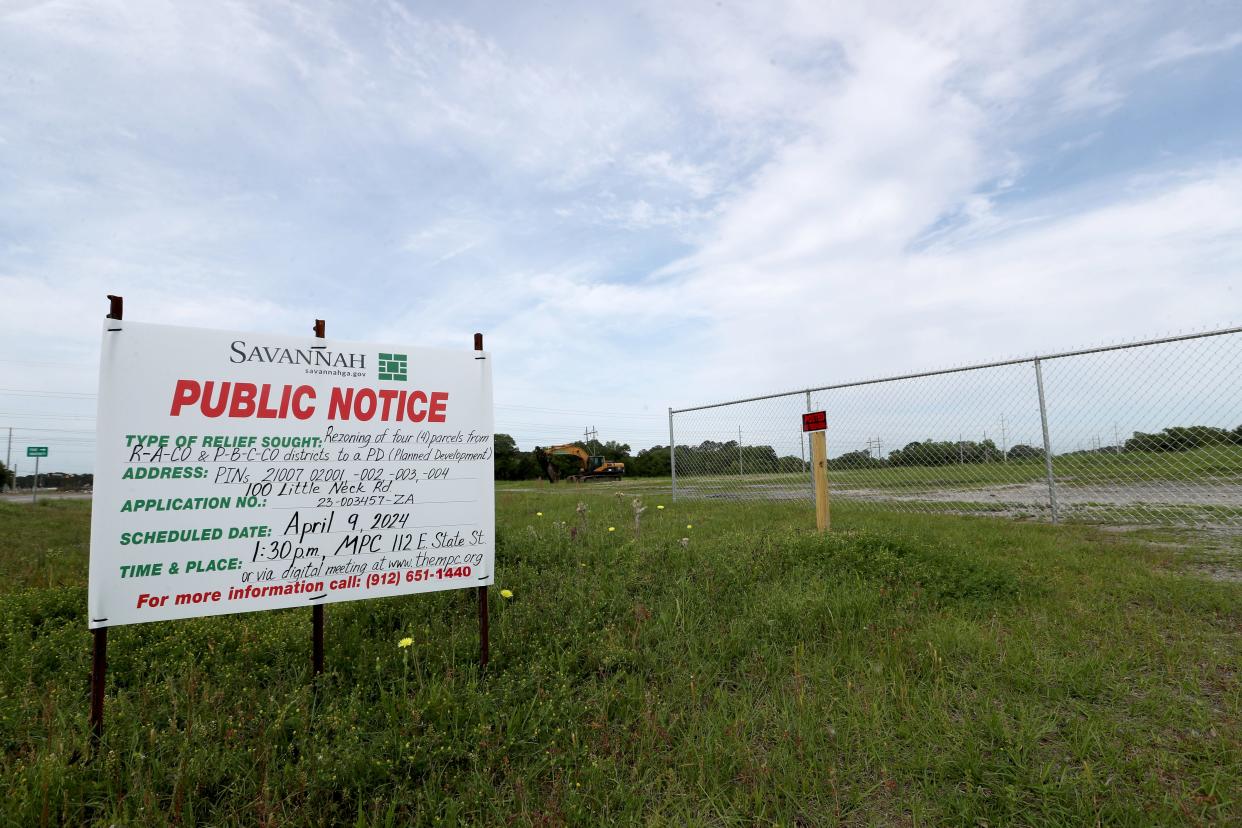 A public notice sign is posted at the property on the corner of Little Neck Road and Ogeechee Road for the rezoning of four parcels.