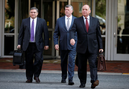 Defense attorneys Richard Westling, Kevin Downing and Thomas Zehnle arrive at the U.S. District Courthouse as jury deliberations are set to begin in former Trump campaign manager Paul Manafort's trial on bank and tax fraud charges stemming from Special Counsel Robert Mueller's investigation of Russia's role in the 2016 U.S. presidential election, in Alexandria, Virginia, U.S., August 16, 2018. REUTERS/Chris Wattie