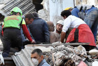 A man is extracted alive from a collapsed building following an earthquake in Amatrice, central Italy, August 24, 2016. REUTERS/Emiliano Grillotti FOR EDITORIAL USE ONLY. NO RESALES. NO ARCHIVES.