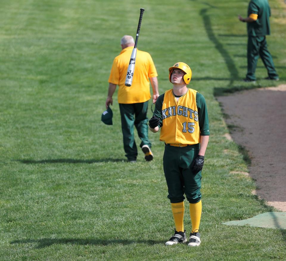 Northeastern senior Payton Lumpkin tosses his bat in the air during a Wayne County Tournament game May 14, 2022.