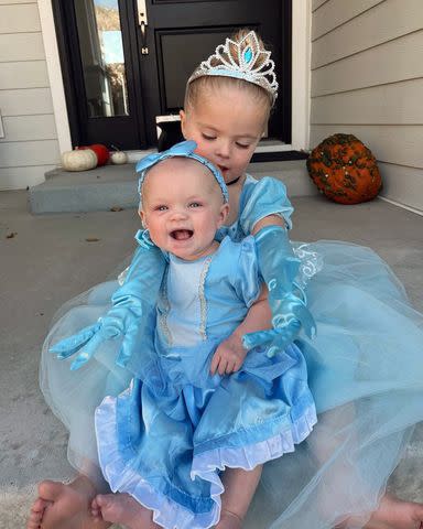 <p>Lindsay Arnold/Instagram</p> Lindsay Arnold shares photos of her daughters June, 5 months, and Sage, 3, on Halloween