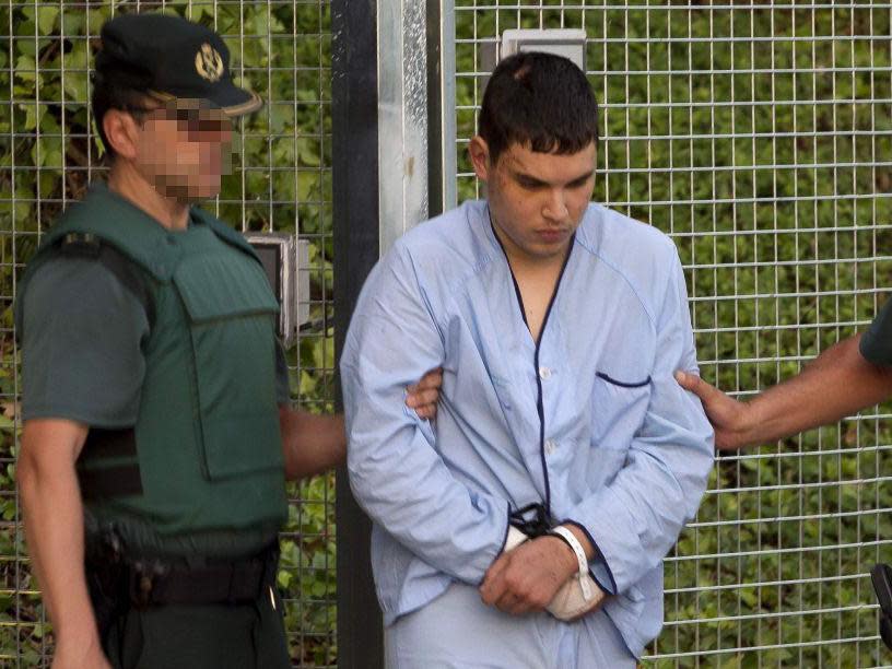 Mohamed Houli Chemlal, suspected of involvement in the terror cell that carried out twin attacks in Spain, is escorted by Spanish Civil Guards to court: AFP/Getty