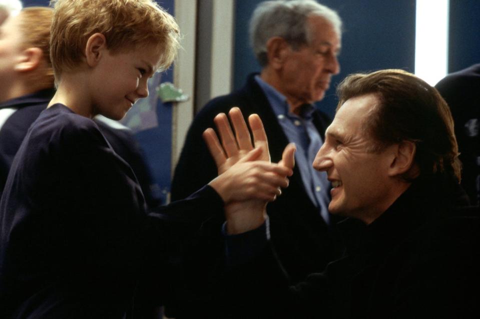 Neeson and Thomas Brodie-Sangster in Love, Actually (Universal Studios)