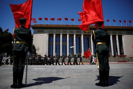 Honour guards march before a welcoming ceremony attended by Chinese Premier Li Keqiang and Hungarian Prime Minister Viktor Orban at the Great Hall of the People in Beijing, China, May 13, 2017. REUTERS/Thomas Peter