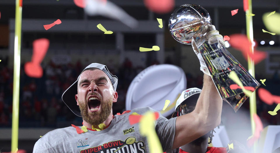 Travis Kelce of the Kansas City Chiefs raises the Vince Lombardi Trophy after defeating the San Francisco 49ers in Super Bowl LIV on Sunday. (Photo by Tom Pennington/Getty Images)