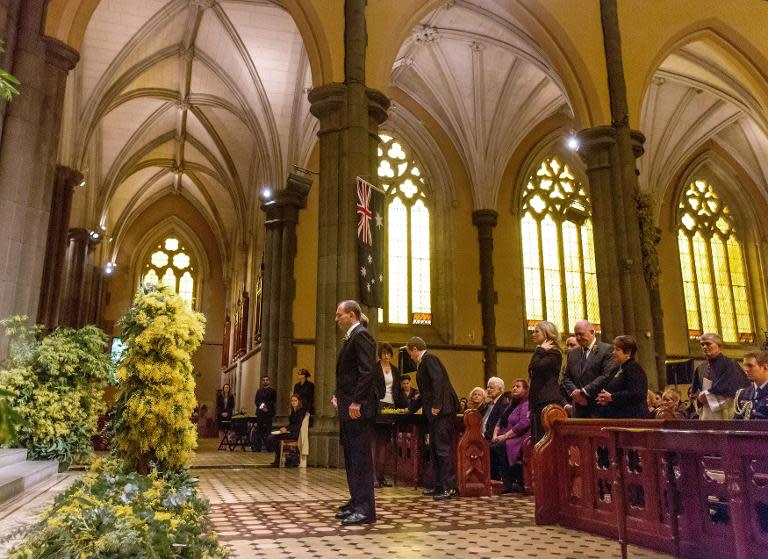 Australian Prime Minister Tony Abbott attend a national memorial service for the victims of Flight MH17 at St. Patrick's Cathedral in Melbourne on August 7, 2014