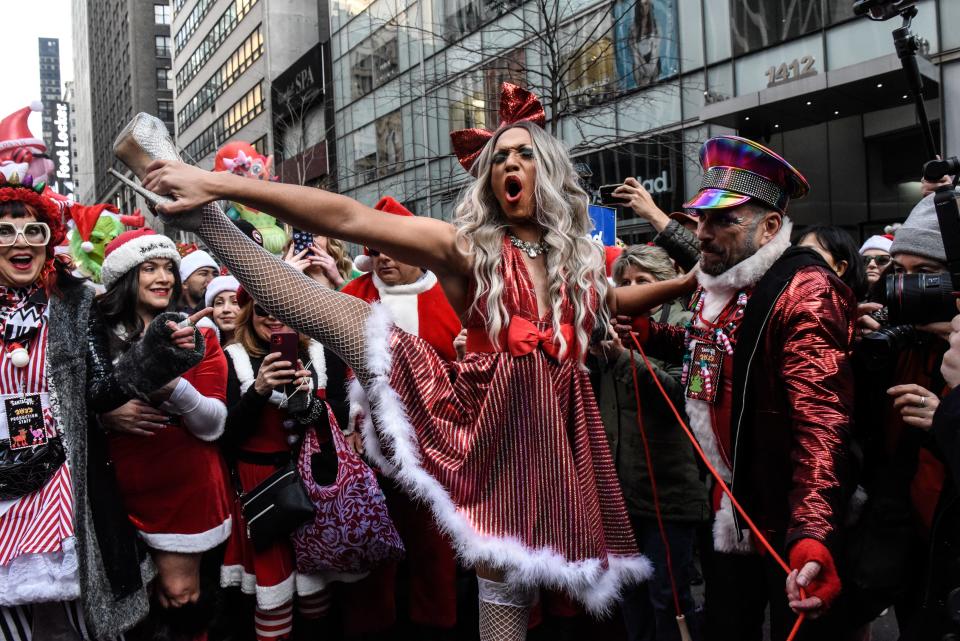 Revelers dressed as holiday characters participate in the annual SantaCon pub crawl on December 9, 2023 in New York City.