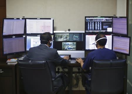 Doctors remotely monitor live footages of patients inside an electronic intensive care unit (eICU) at Fortis hospital in New Delhi, India, January 20, 2016. REUTERS/Adnan Abidi