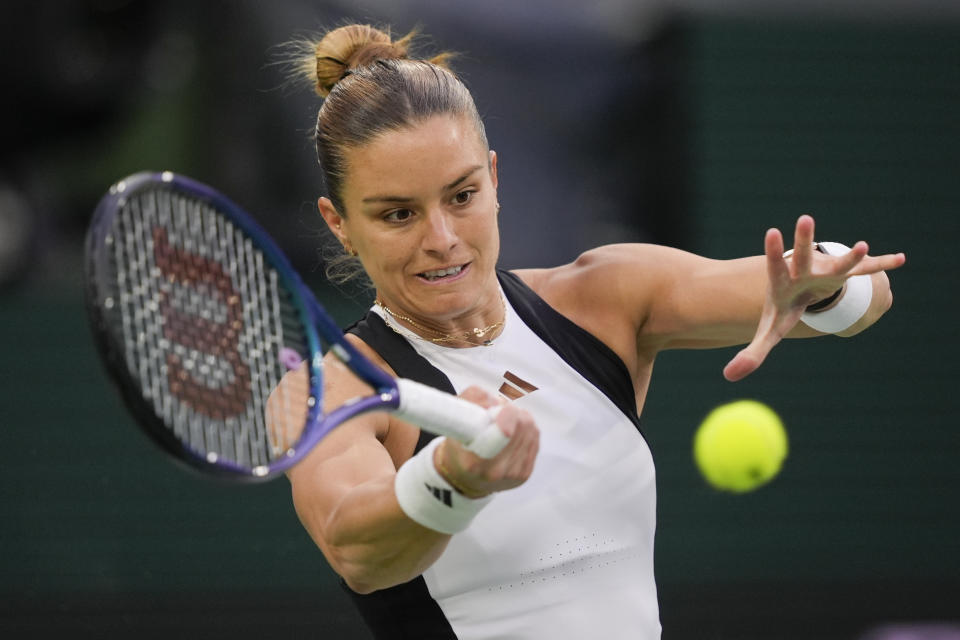 Maria Sakkari, of Greece, returns to Coco Gauff, of the United States, during a semifinal match at the BNP Paribas Open tennis tournament, Friday, March 15, 2024, in Indian Wells, Calif. (AP Photo/Ryan Sun)