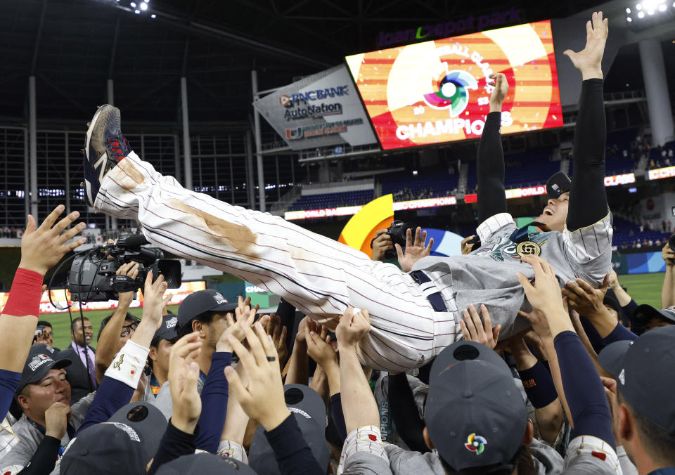 Mar 21, 2023; Miami, Florida, USA;  Japan designated hitter Shohei Ohtani (16) and team Japan celebrate after defeating the USA in the World Baseball Classic at LoanDepot Park. Mandatory Credit: Rhona Wise-USA TODAY Sports