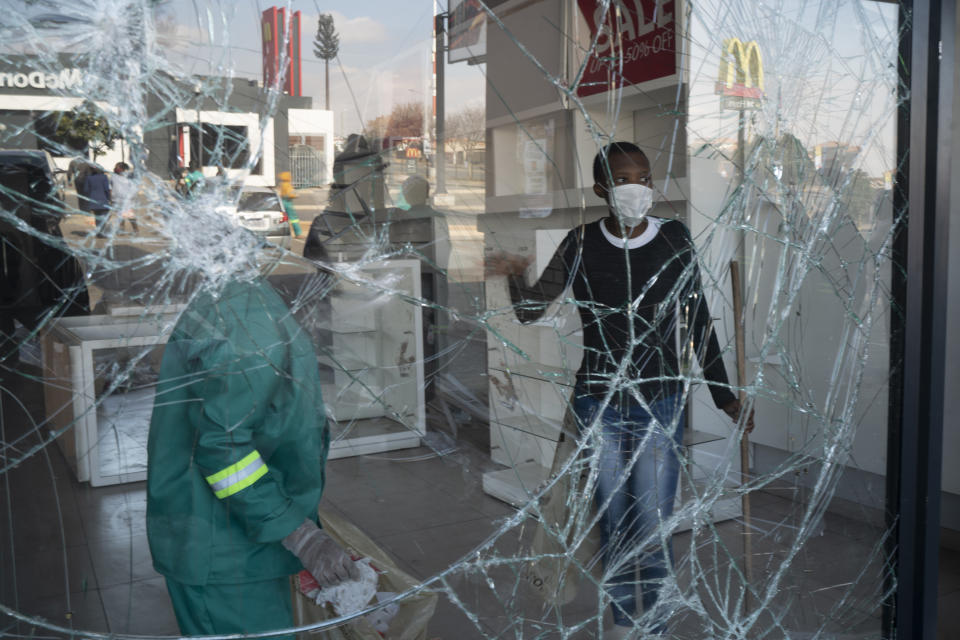 Volunteers participate in the cleaning efforts at Soweto's Diepkloof mall outside Johannesburg, South Africa, Thursday July 15, 2021. A massive cleaning effort has started following days of violence in Gauteng and KwaZulu-Natal provinces. The violence erupted last week after Zuma began serving a 15-month sentence for contempt of court for refusing to comply with a court order to testify at a state-backed inquiry investigating allegations of corruption while he was president from 2009 to 2018. (AP Photo/Jerome Delay)