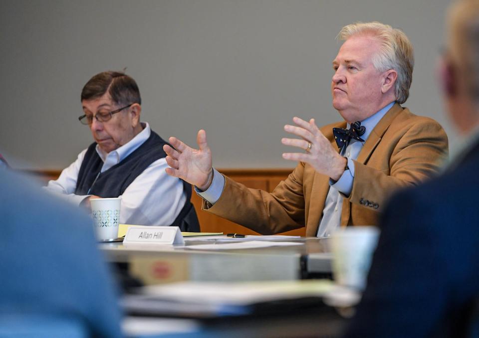 Greenville County Library System Board Chairman Allan Hill, right, speaks near Vice Chairman Sid Cates at the Board of Trustees meeting at the Hughes Main Library in Greenville, S.C. Monday, December 5, 2022.