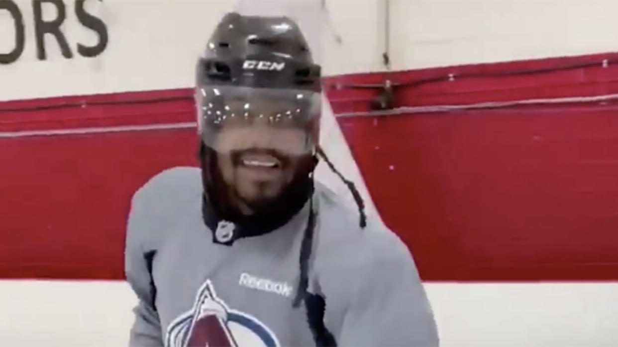 Marshawn Lynch playing hockey