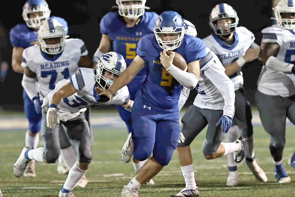 Madeira running back Nick Heisser runs the ball in a football game with Reading Friday, Sept.23, 2022. The Mustangs are currently 8-0.