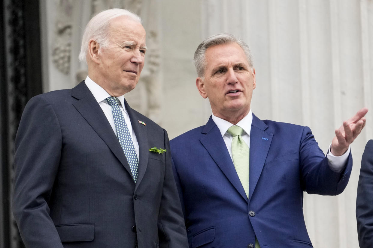 President Joe Biden talks with House Speaker Kevin McCarthy in Washington on March 17, 2023. (Alex Brandon / AP file)