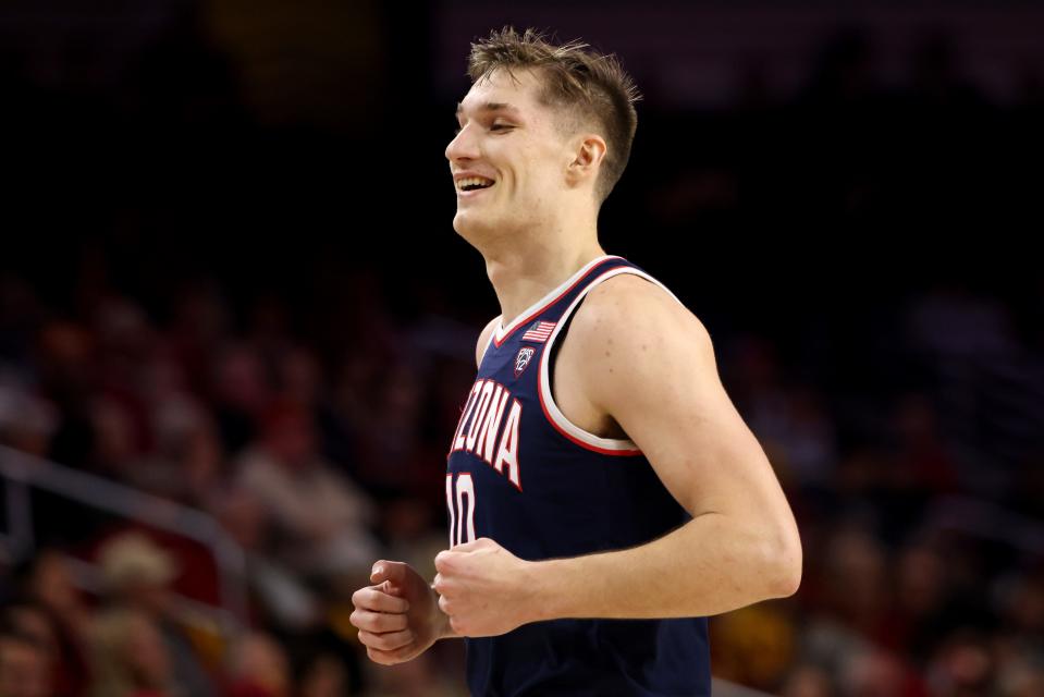 Azuolas Tubelis (10) of the Arizona Wildcats reacts after a dunk during the first half against the USC Trojans at Galen Center in Los Angeles, California, on March 02, 2023.