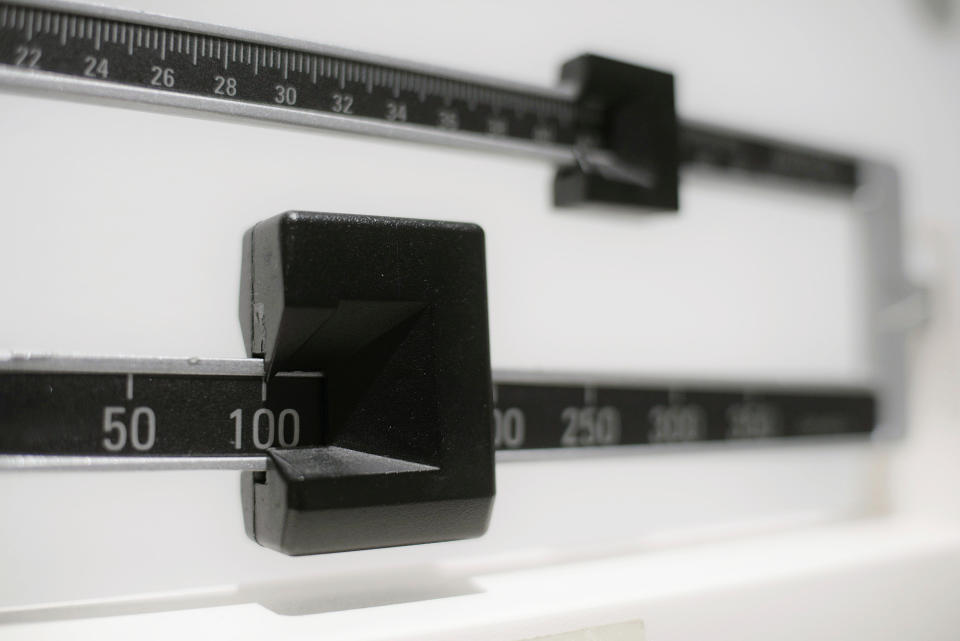 This Tuesday, April 3, 2018 photo shows a closeup of a beam scale in New York. New research released on Wednesday, April 4, 2018 suggests there's a critical window for overweight kids to get to a healthy level. Those who shed their extra pounds by age 13 had the same risk of developing diabetes in adulthood as others who had never weighed too much, a large study of Danish men found. (AP Photo/Patrick Sison)