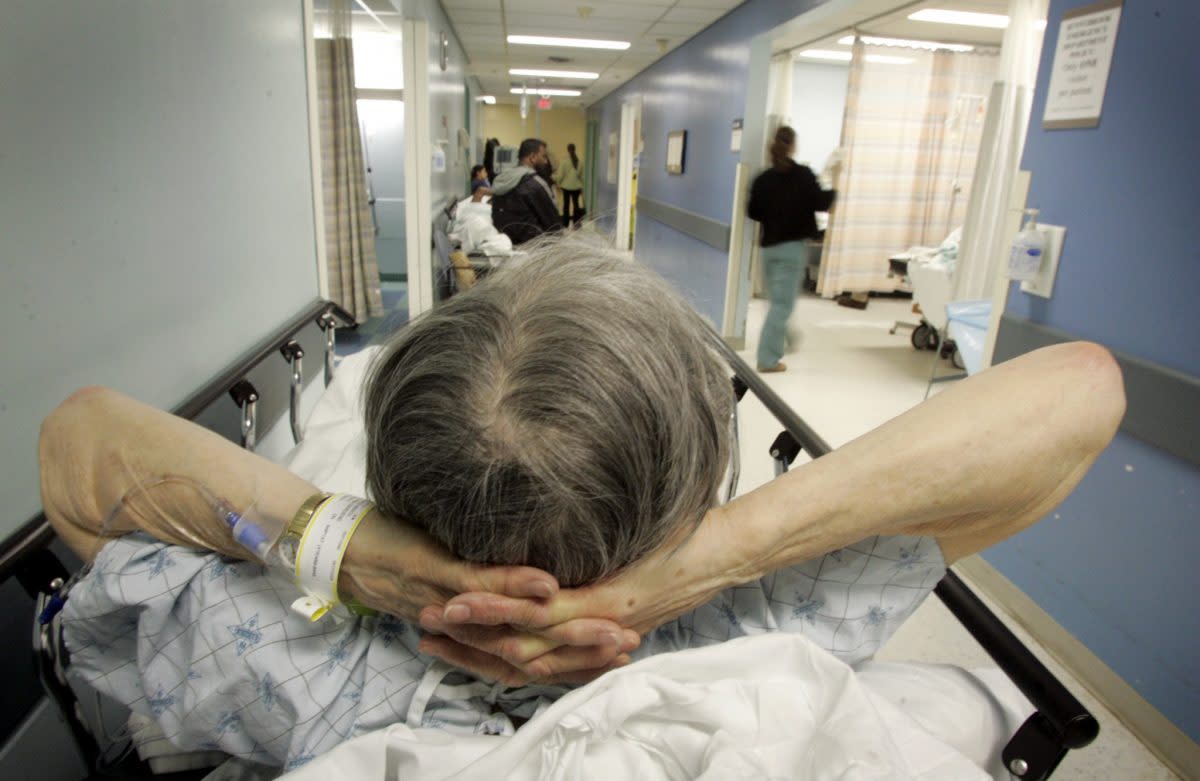 An elderly patient waits in the emergency room at Sunnybrook hospital in Toronto, Ont. A new report shows wait times in Ontario are going down. Photo by Peter Power/Toronto Star via Getty Images