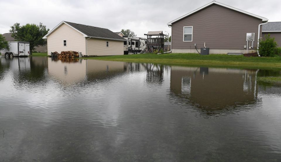 Matthews Drive saw flooding due to heavy rain Wednesday, June 15, 2022, in Gilbert, Iowa.