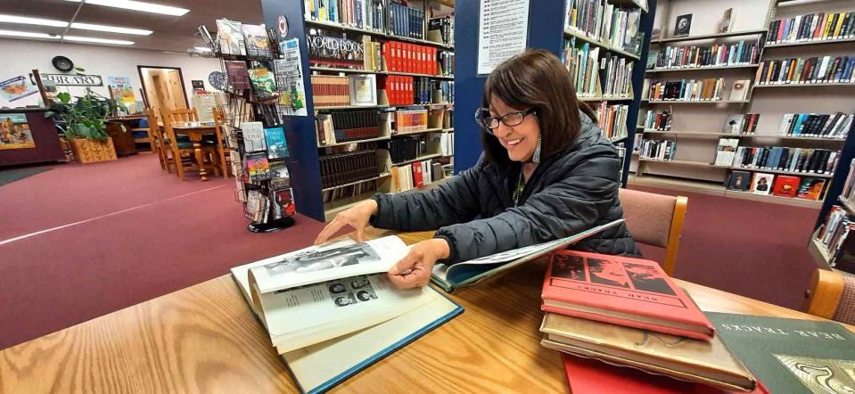 Magdalena Hinckley, a Utah resident spending the winter in Southern New Mexico, visits the Hatch Public Library on Thursday, Jan. 25, 2024 to review yearbooks from the late 1960s. She attended Hatch schools through the seventh grade and says she’s glad the library had the books on hand.