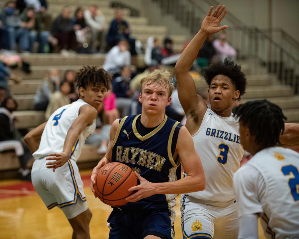 Hayden's Jake Muller (3) drives for the basket Thursday. Hayden fell to Wichita Northwest.