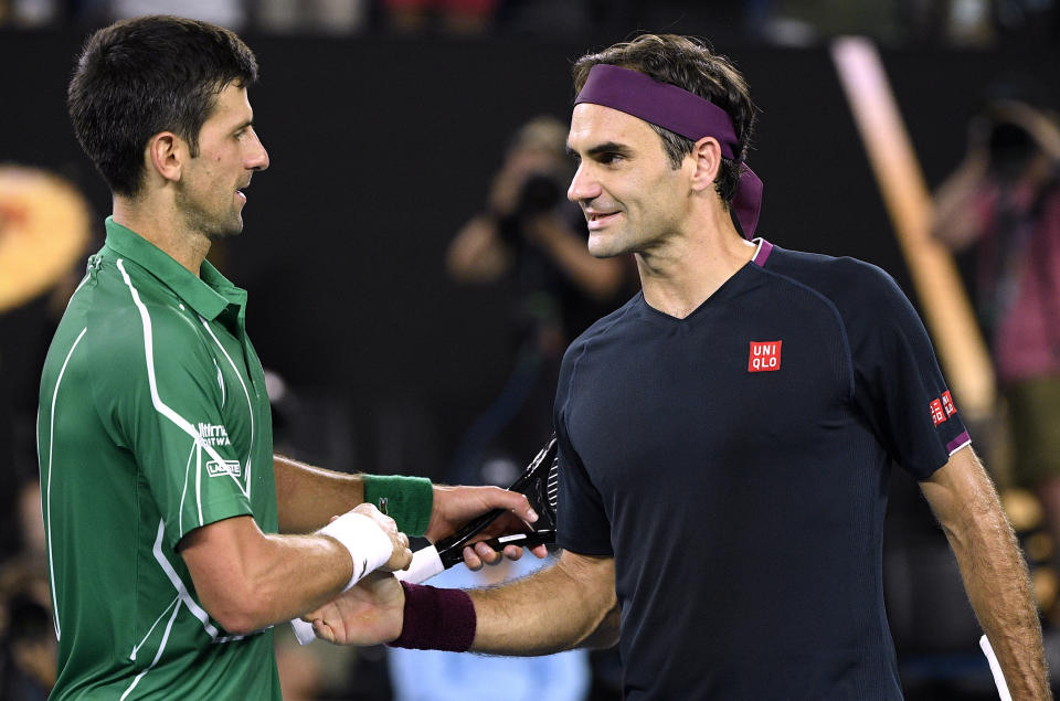 Roger Federer（圖右）與Novak Djokovic。(AP Photo/Andy Brownbill)