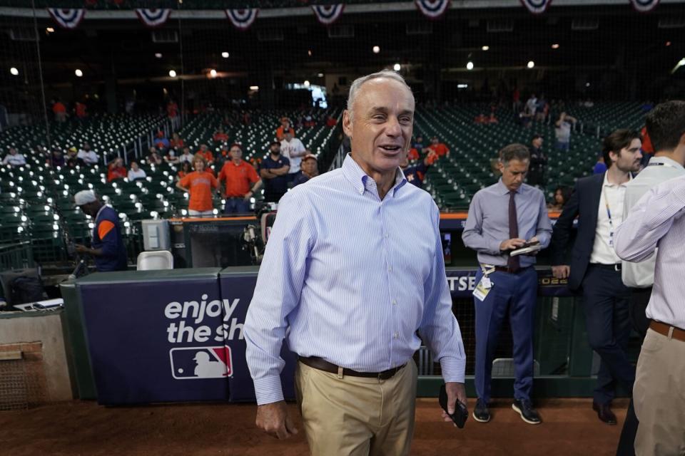 Major League Baseball commissioner Rob Manfred walks on the field before Game 2 of the ALDS.