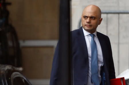 PM hopeful Sajid Javid is seen near the Houses of Parliament in London