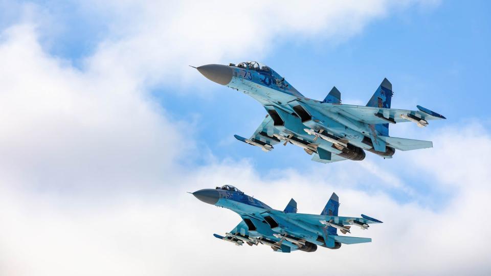 two su 27 fighters fly over a military base in the zhytomyr