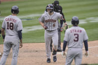 Houston Astros' Chas McCormick (6) smiles after hitting a three-run home run that scored Jason Castro (18) and Myles Straw (3) against the Oakland Athletics during the sixth inning of a baseball game in Oakland, Calif., Sunday, April 4, 2021. (AP Photo/Jeff Chiu)