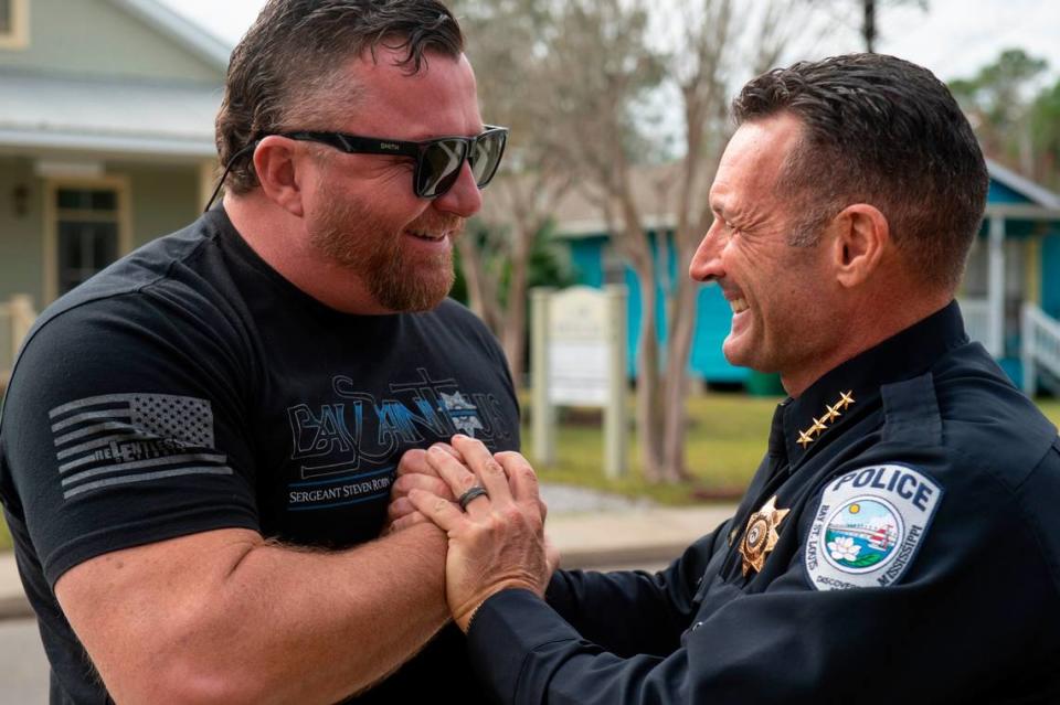 Ian Estorffe, left, and Bay St. Louis Police Chief Toby Schwartz embrace after a ceremony dedicating commemorative stars in honor of Sergeant Steven Robin and Officer Branden Estorffe outside the new Bay St. Louis Police Department in Bay St. Louis on Thursday, Dec. 14, 2023.